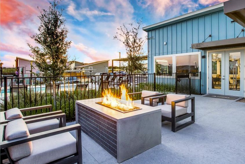 Patio seating next to a modern firepit